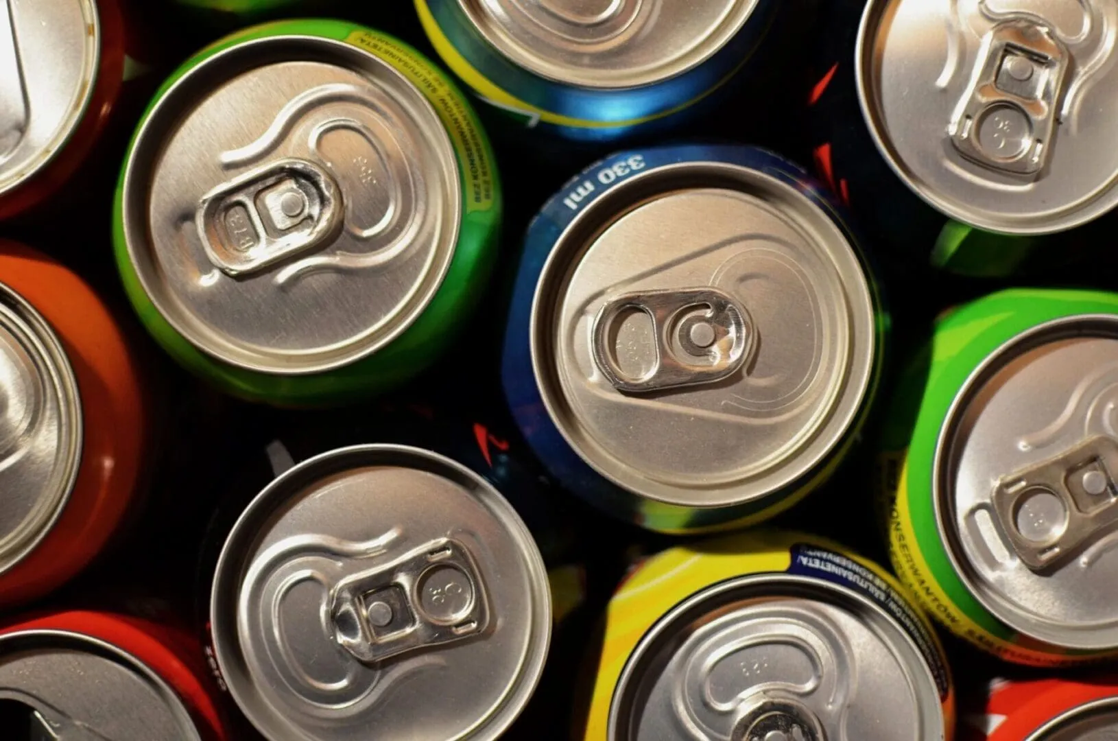 Close-up of colorful soda can tops