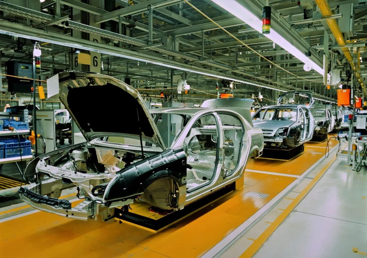 Car bodies on automotive assembly line in factory