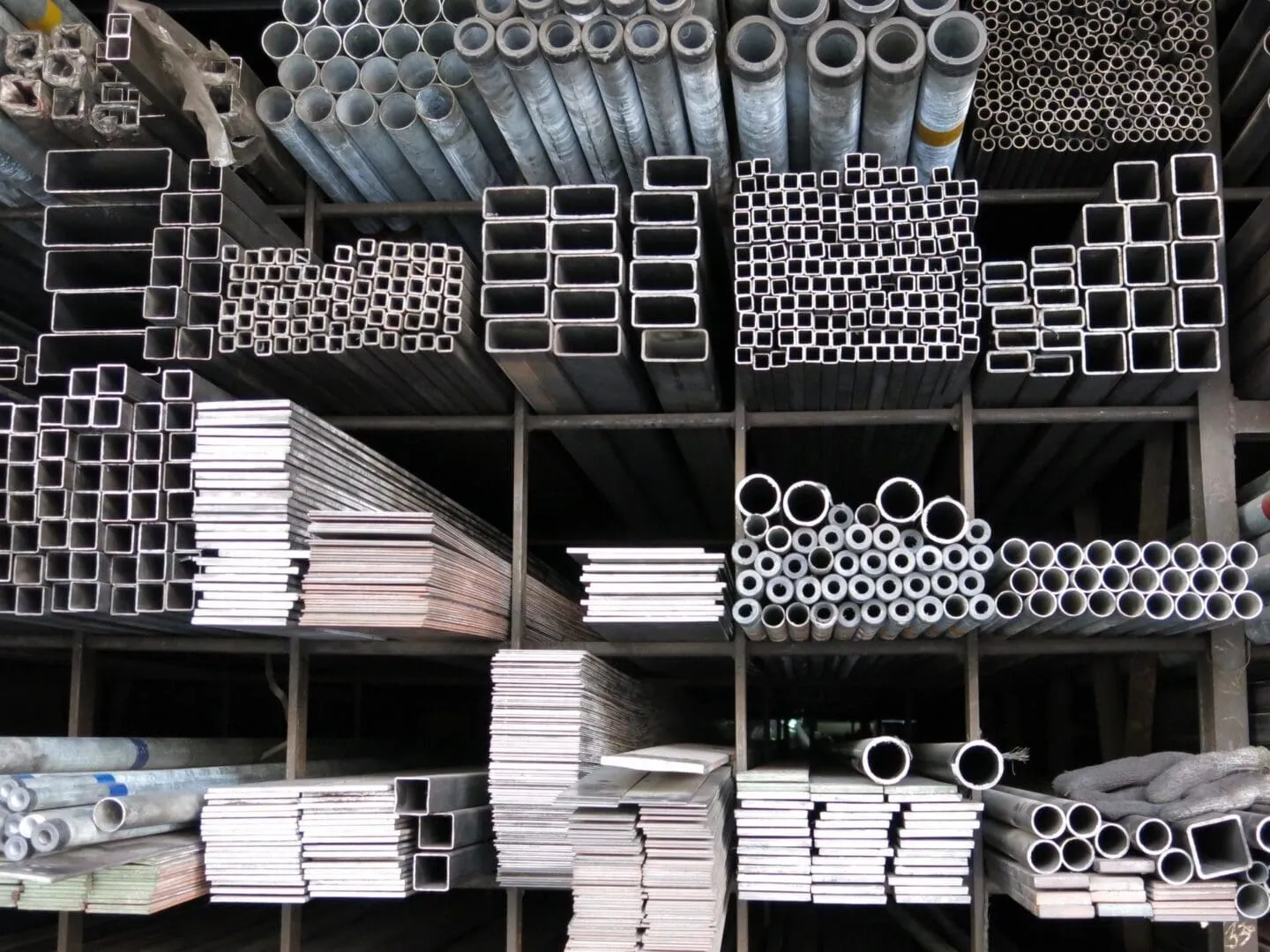 Stacked metal pipes and square tubing