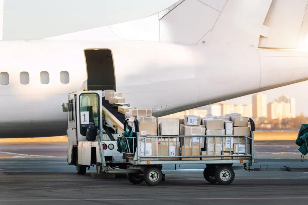 Airplane cargo loading with boxes on cart