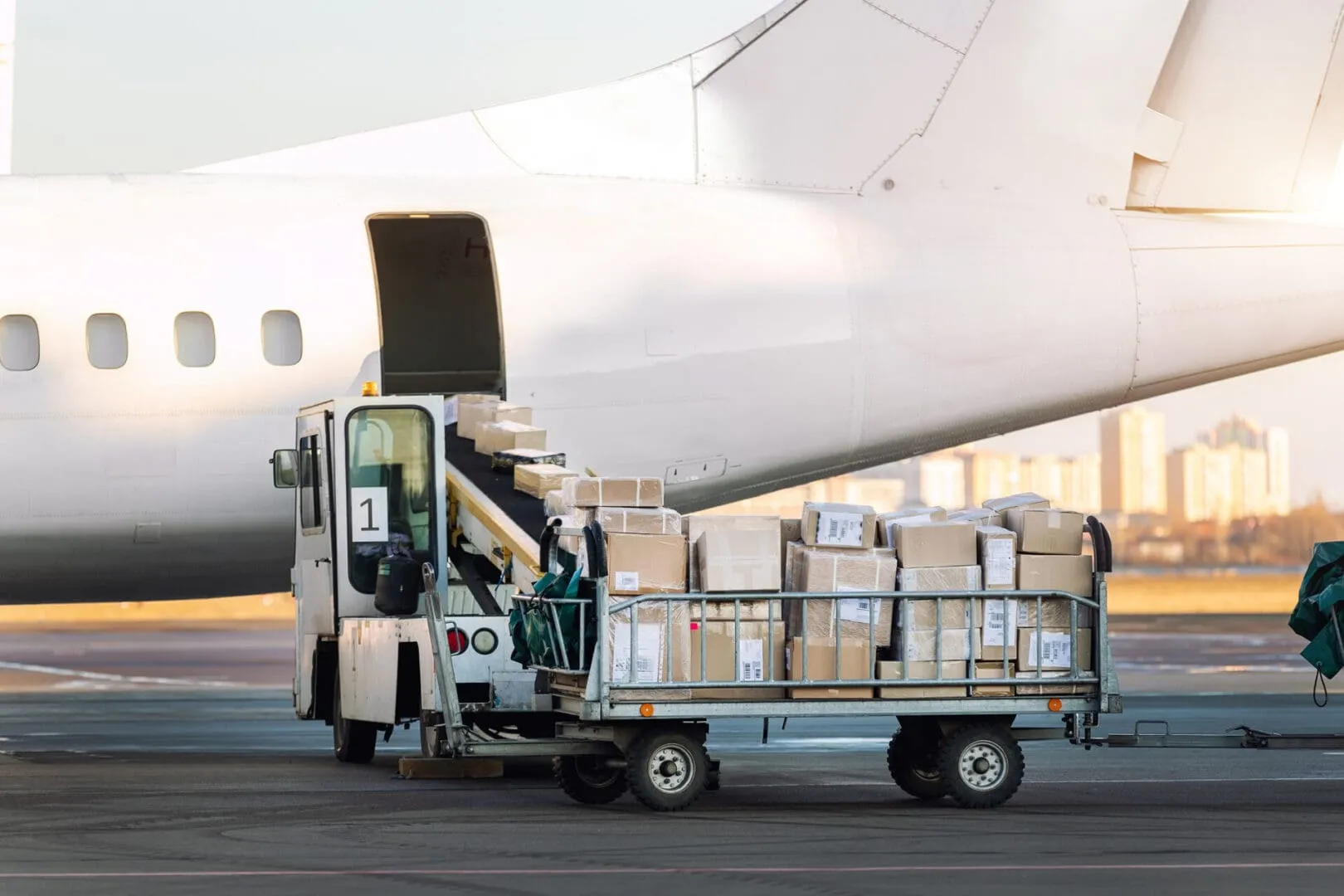 Airplane cargo loading with boxes on cart