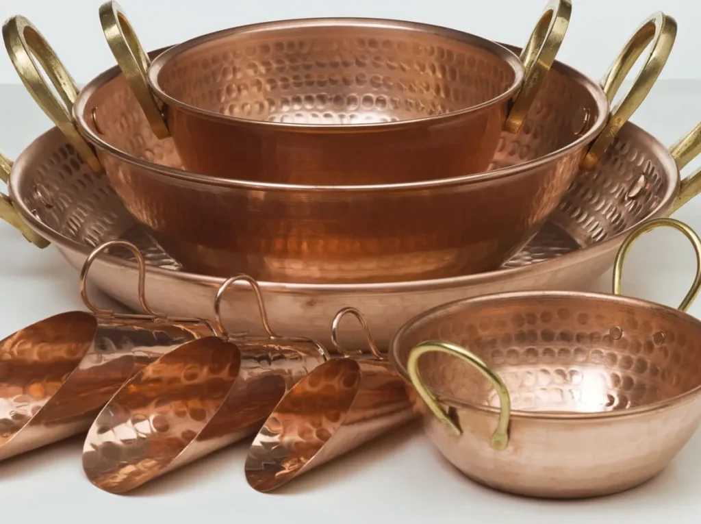 Hammered copper cookware set with brass handles