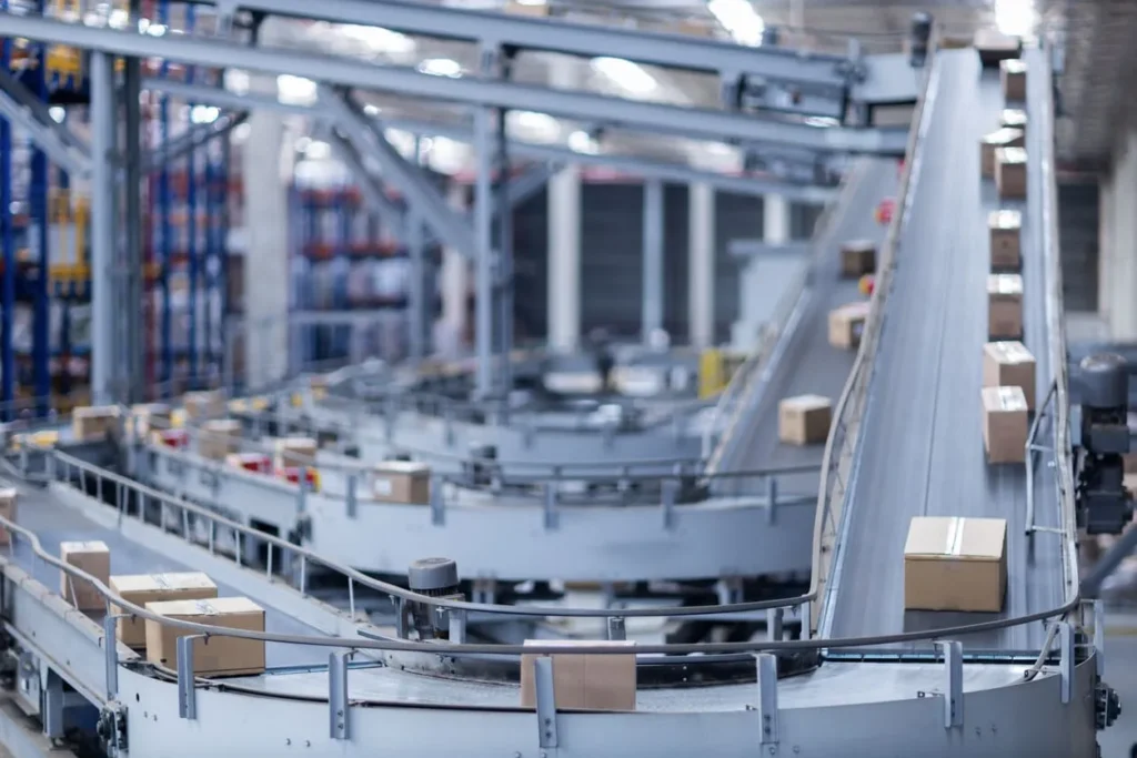 Automated warehouse conveyor moving cardboard packages
