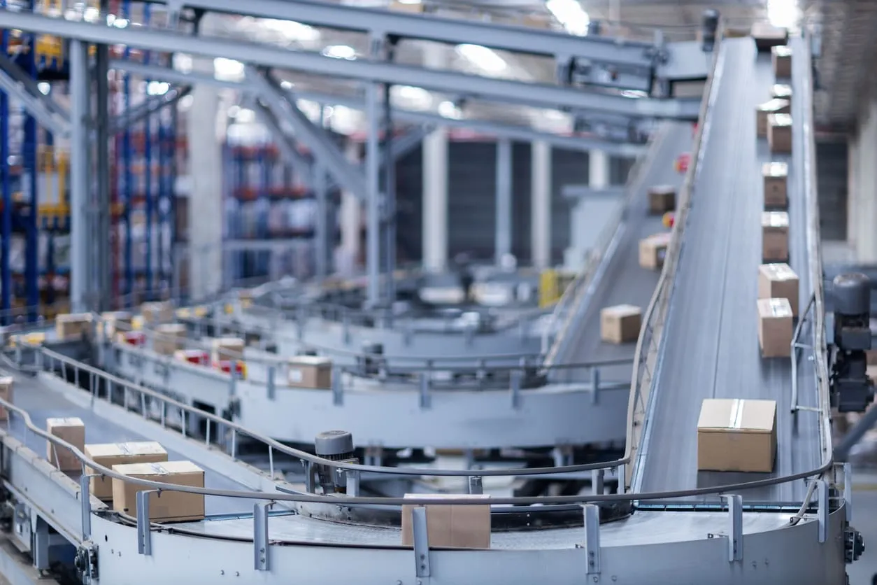 Automated warehouse conveyor moving cardboard packages