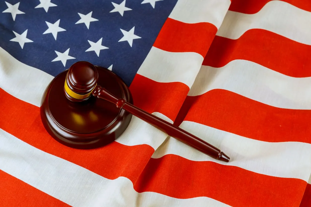 Judge gavel on American flag symbolizing justice